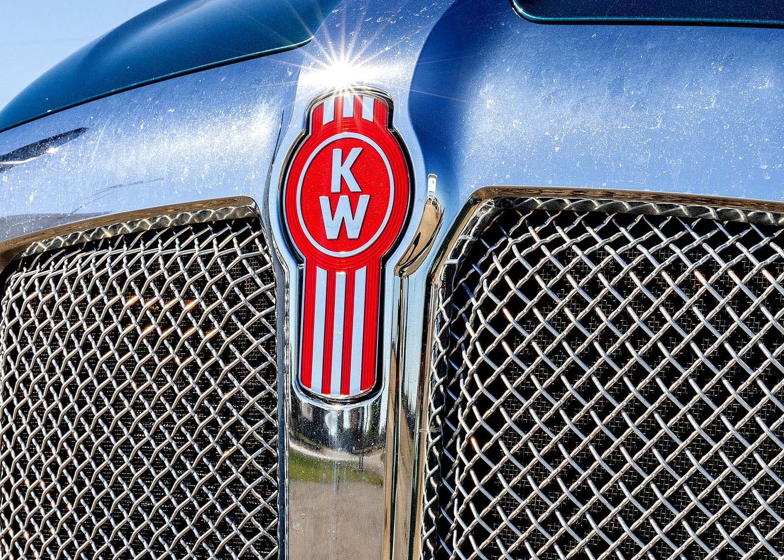 Kenworth truck grille with the red and white KW logo and chrome trim