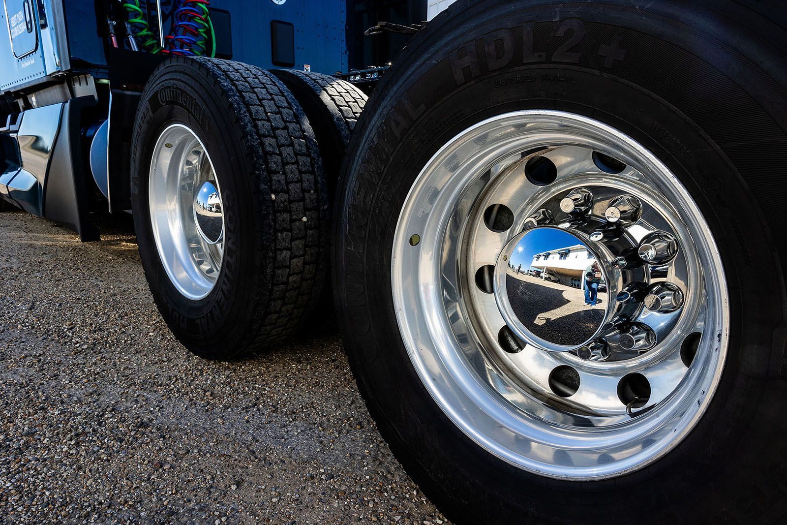 Shiny chrome truck wheels on gravel surface