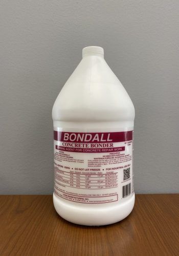 White Bondall cleaning product bottle with maroon label on a wooden table