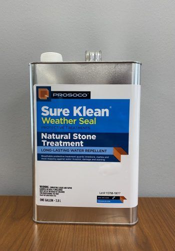 Bottle of Sure Klean Weather Seal Natural Stone Treatment on a wooden table