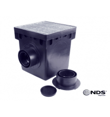 Black drainage box with gridded top and side pipe opening, shown with removable cap and fitting pieces, NDS logo