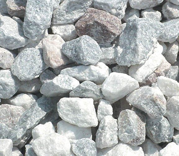 A close-up view of crushed white and grey stones with varied shapes and textures.