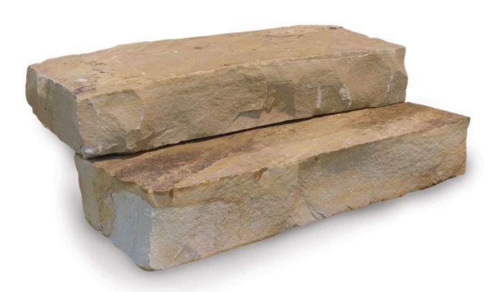 Two stacked, rectangular beige sandstone blocks with rough-hewn, natural textures on a white background.