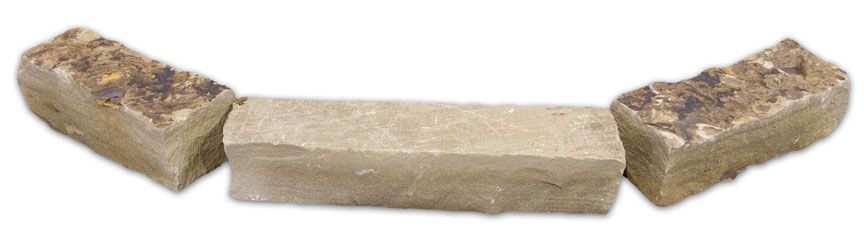 Three rectangular, light-colored landscape edging stones arranged in a gentle curve against a white background.