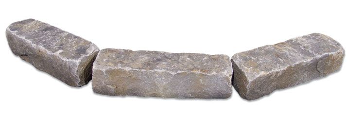 Three rectangular, weathered gray stone landscaping blocks arranged in a shallow arc on a white background.