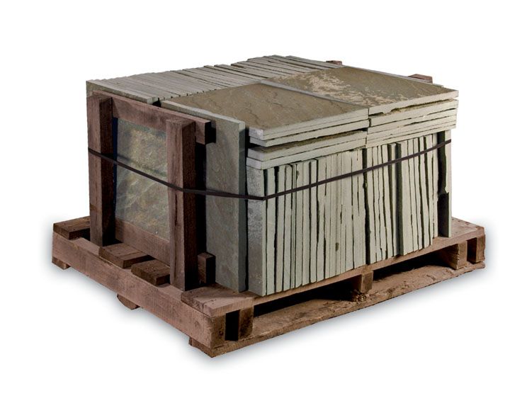 A pallet holding a stack of square, light-brown stone tiles bound by black plastic straps.