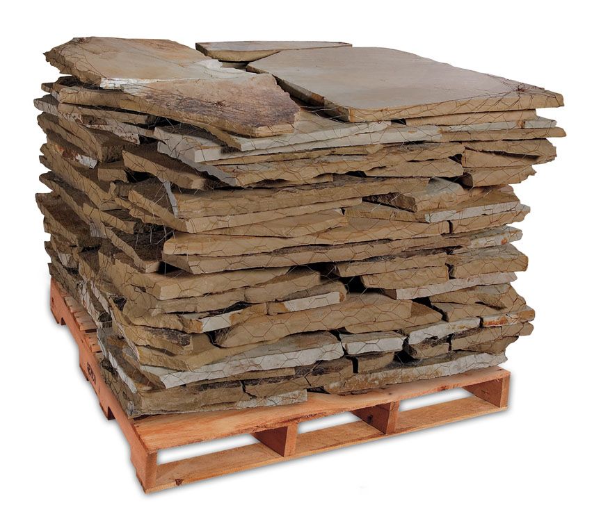 A stack of flat, brown natural stone slabs piled neatly on a wooden shipping pallet against a white background.