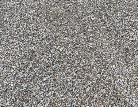 Close-up of gray and beige gravel stones covering the ground