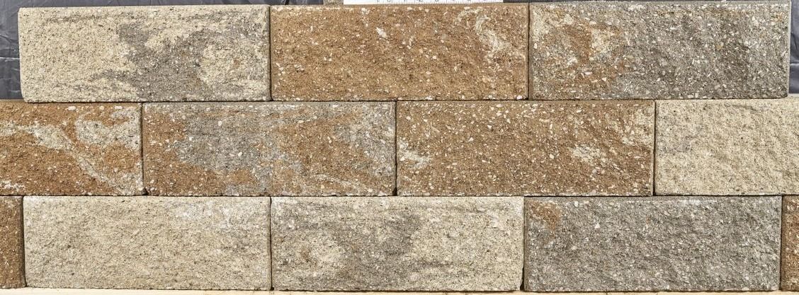 Beige and brown stacked stone wall tiles with a textured, rustic surface