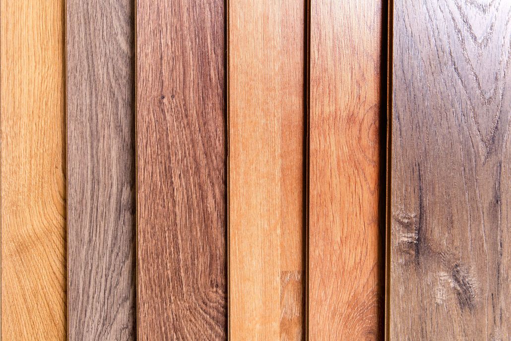 Various wooden planks in shades of brown, showcasing different wood grains and colors.