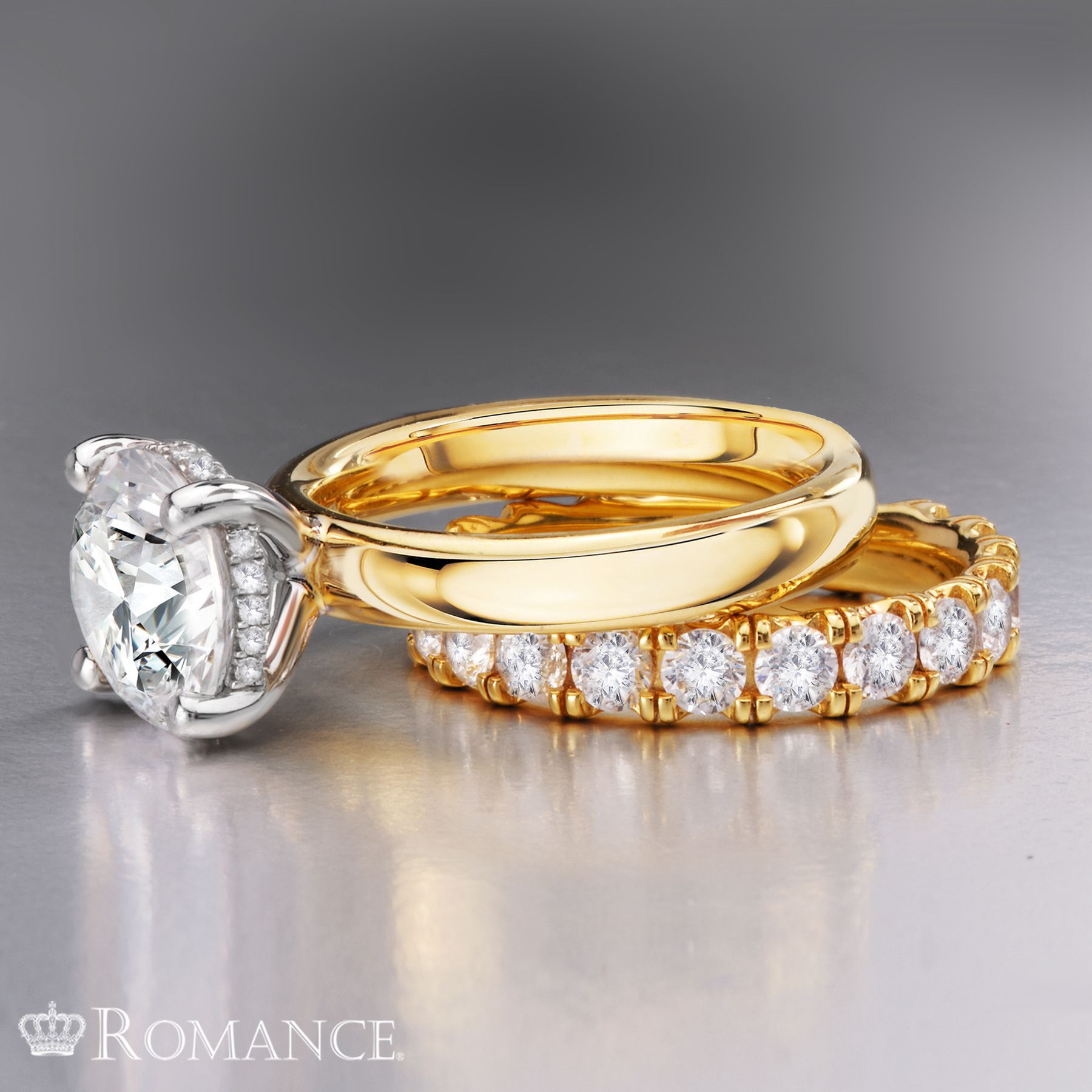 A couple of rings with the word romance on the bottom