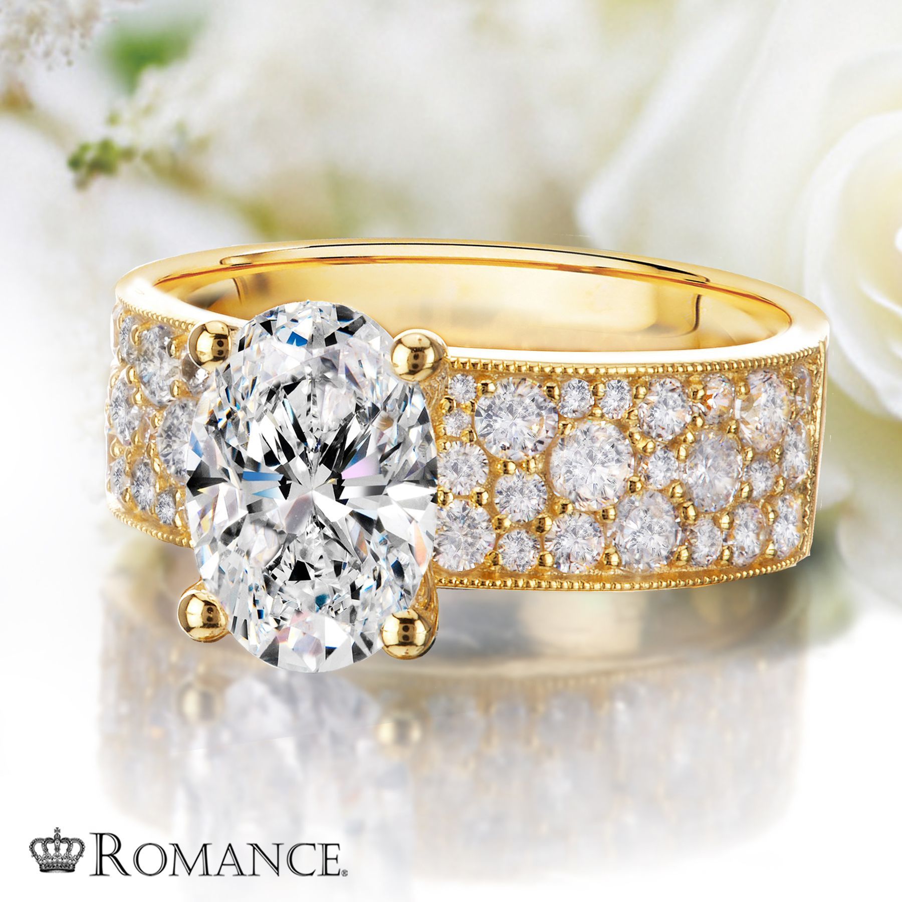 A yellow gold ring with a diamond in the center