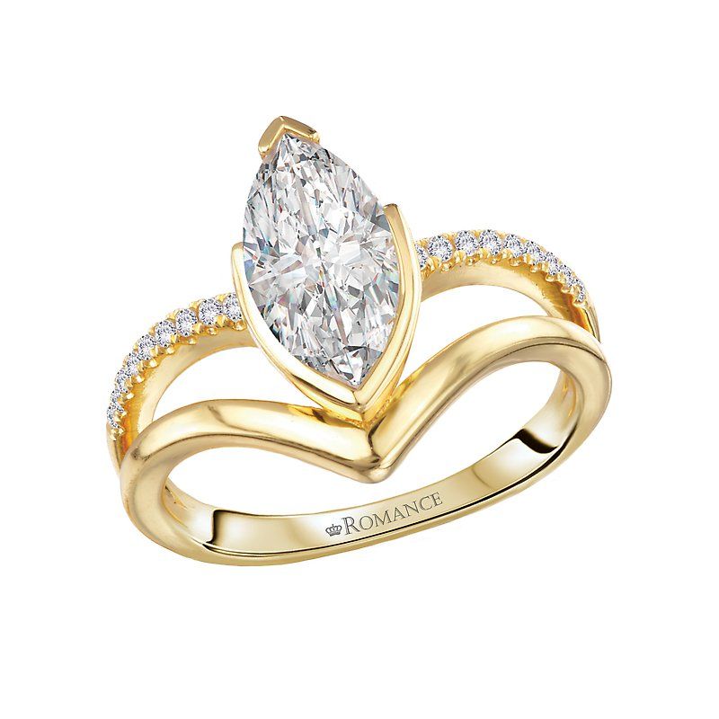 A yellow gold ring with a marquise diamond and diamonds