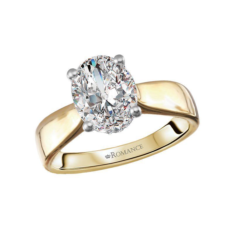 A yellow gold ring with an oval diamond in the center