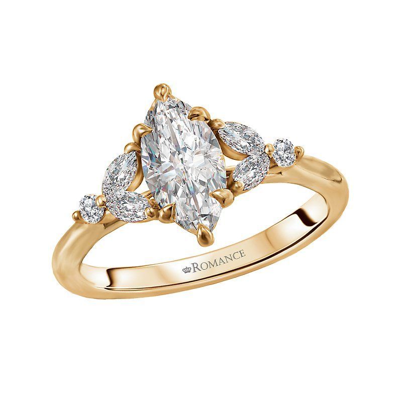 A yellow gold ring with a marquise diamond in the center surrounded by smaller diamonds.