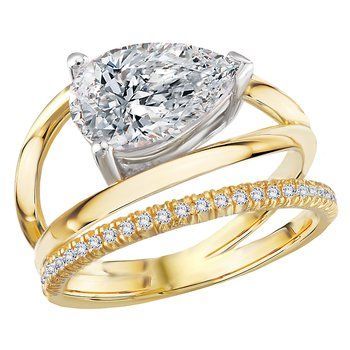 A yellow gold ring with a pear shaped diamond in the center.