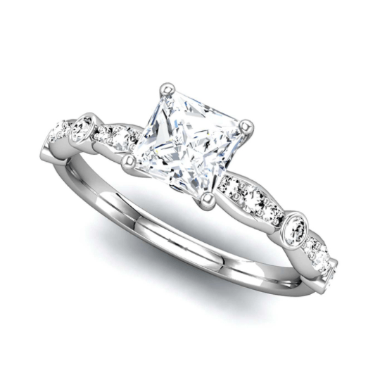 A white gold ring with a square diamond in the center