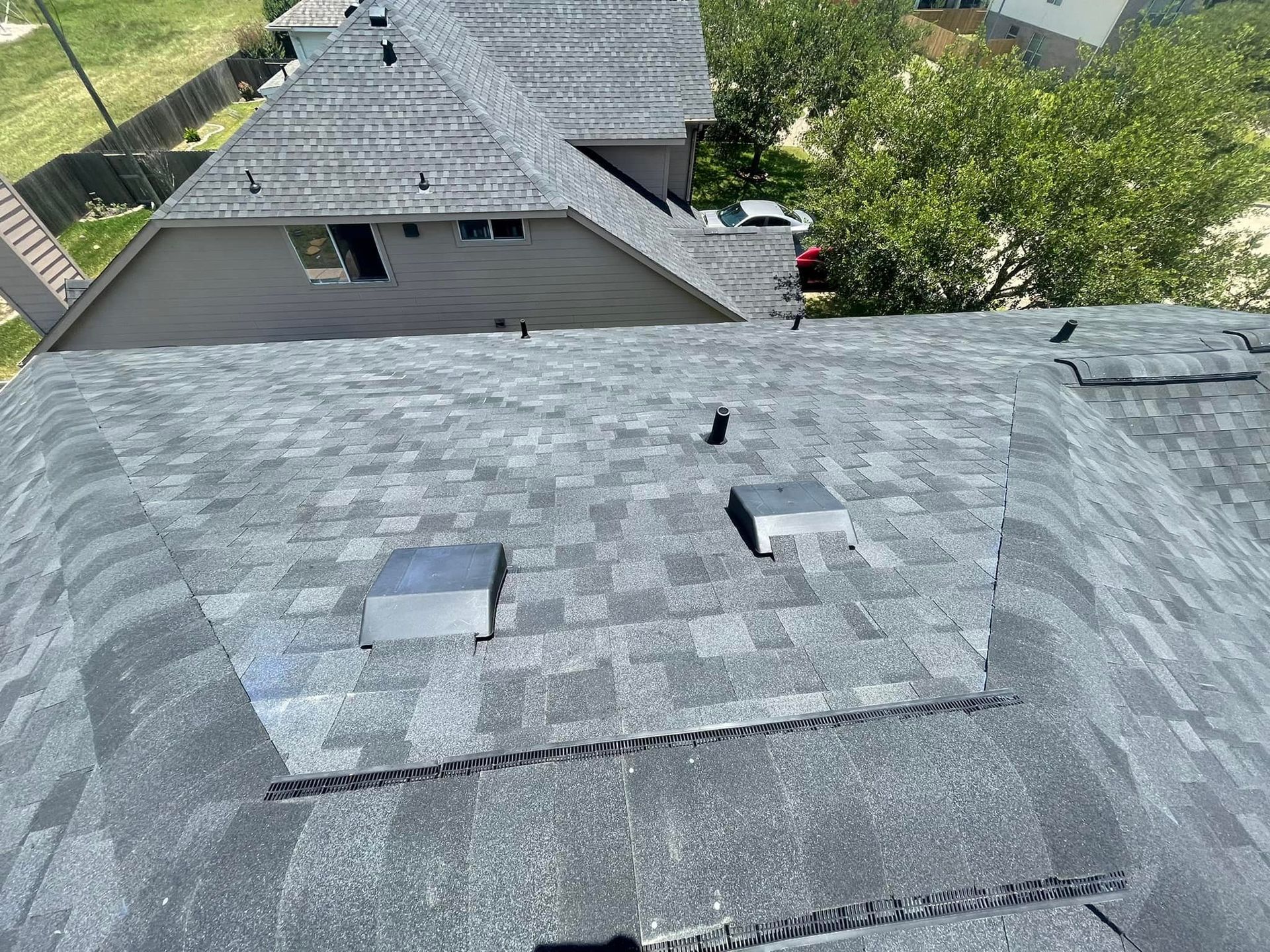 An aerial view of a roof with a lot of shingles on it.