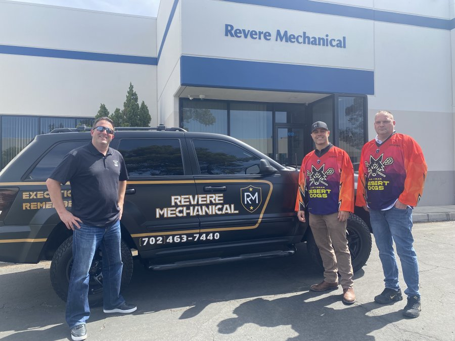 Revere Mechanical LLC staff standing in front of service truck