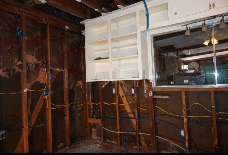 A room with a lot of wooden beams and shelves.