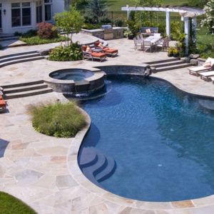 A large swimming pool with stairs leading to it