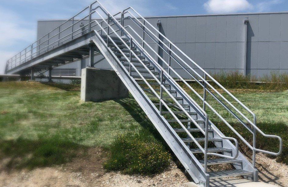A set of metal stairs leading up to a building.