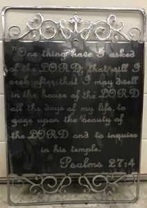 A chalkboard with a bible verse on it