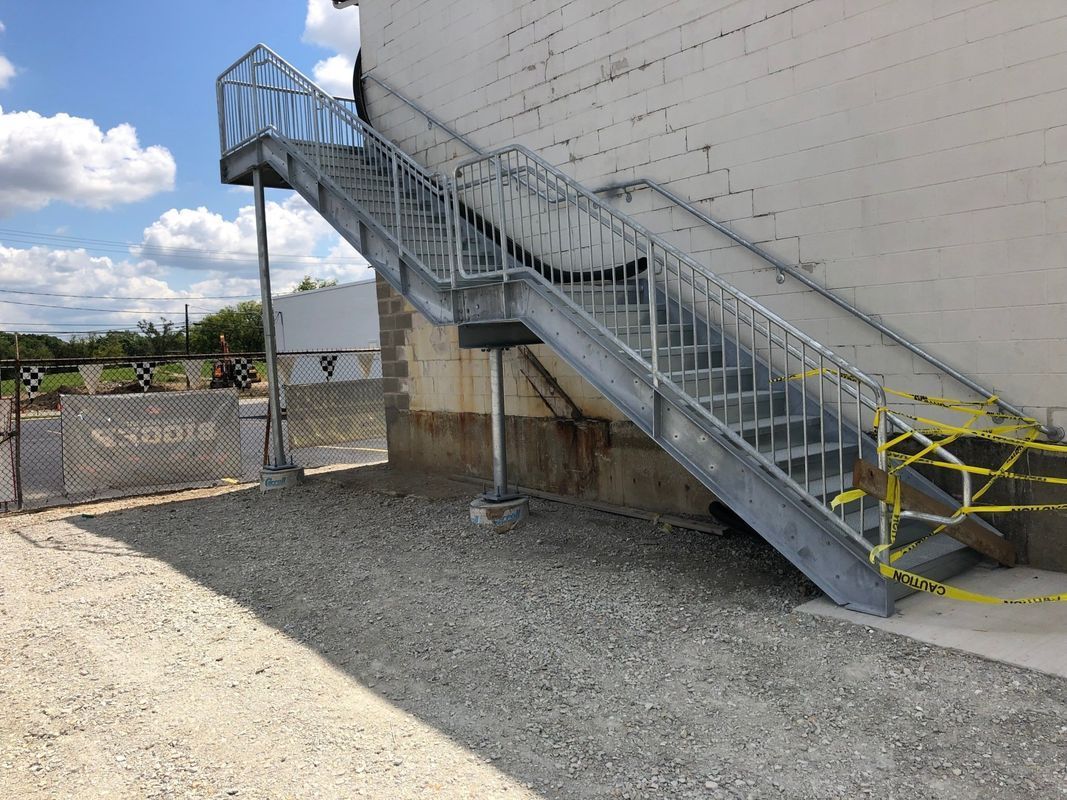 A set of metal stairs leading up to a building.