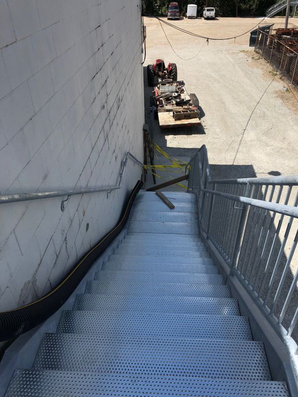 A set of metal stairs leading up to a building