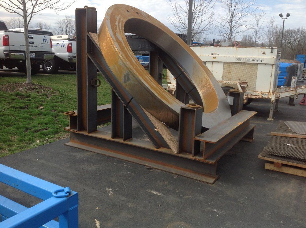 A large metal object is sitting in a parking lot