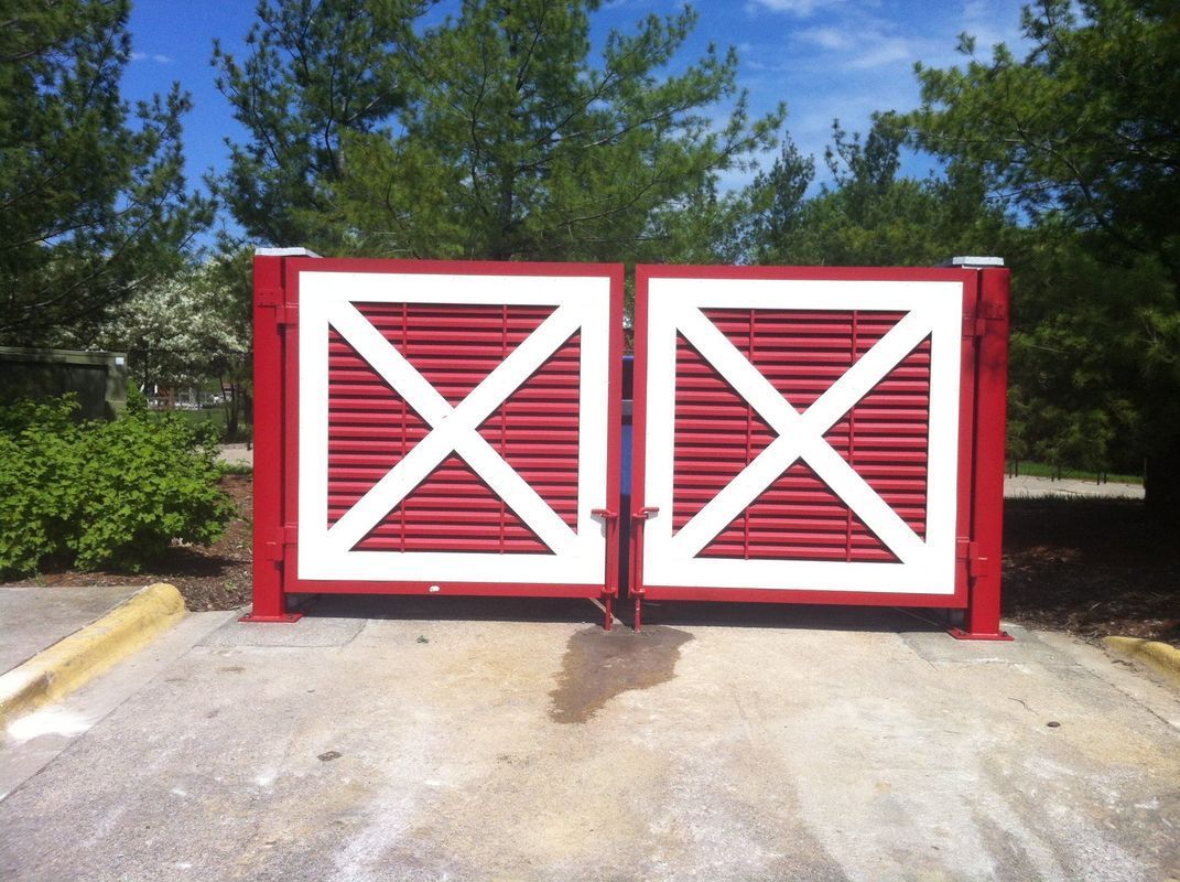 A red and white gate with the letter x on it