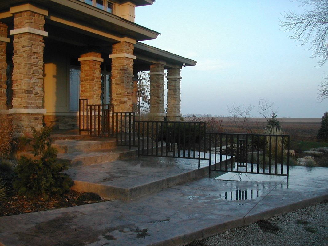 A house with a porch and stairs leading up to it
