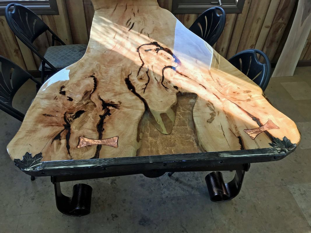 A wooden table with a piece of wood on top of it