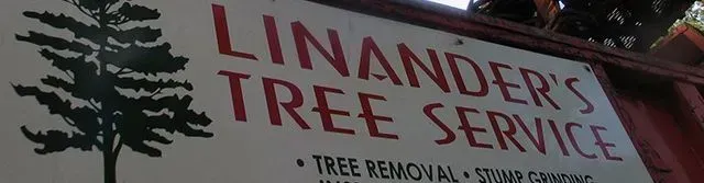 Sign for Linander's Tree Service, featuring a tree illustration and service descriptions: Tree Removal and Stump Grinding.