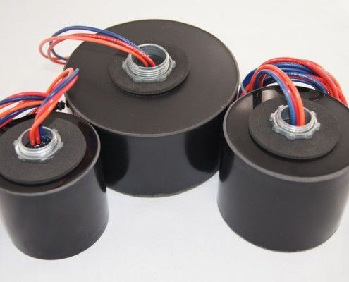 Three black cylinders with wires coming out of them
