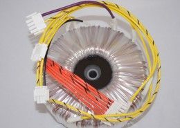 A close up of a transformer with wires attached to it.