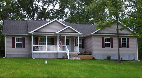 A house with a porch and shutters on it