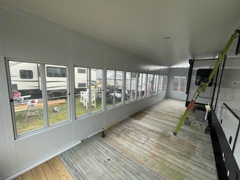 A camper room with a lot of windows