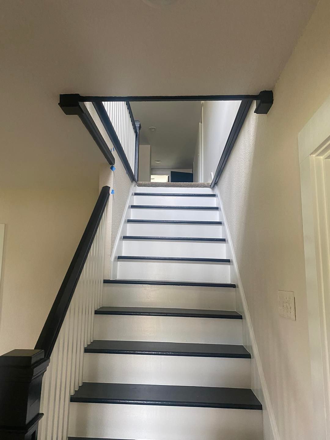 A set of stairs leading up to a second floor in a house.