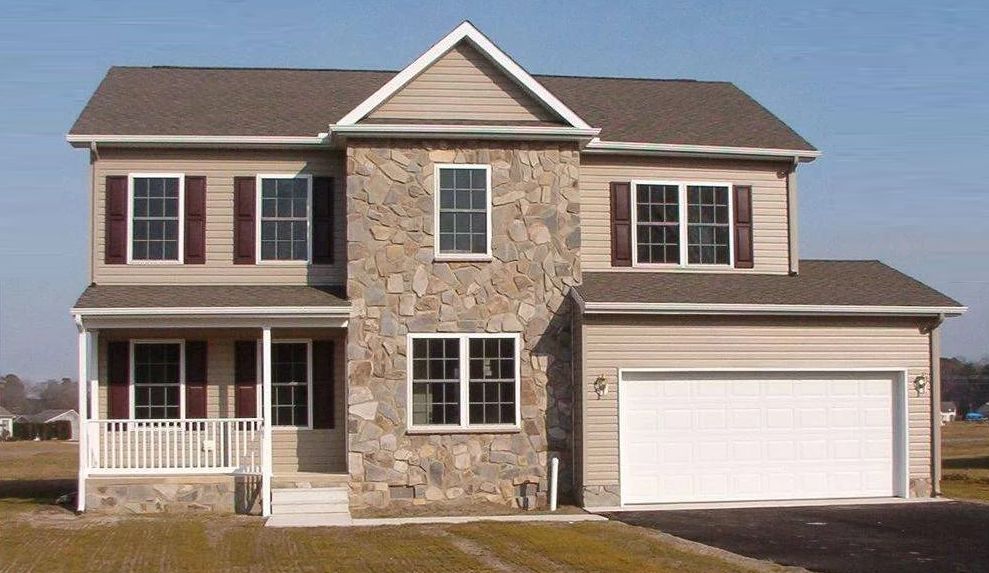 A large house with a garage and a porch