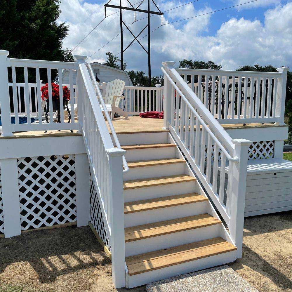 A white deck with stairs leading up to it