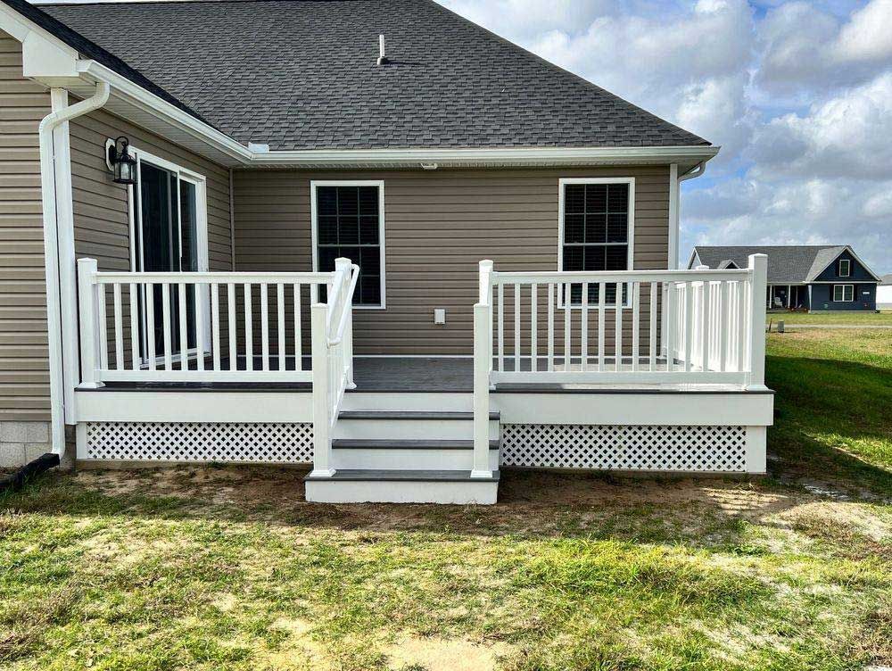 The back of a house with a porch and stairs
