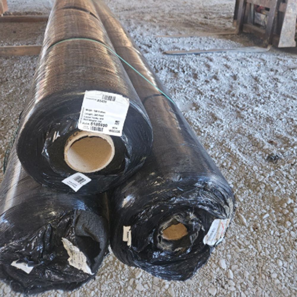 Three rolls of non-woven fabrics with plastic are stacked on top of each other