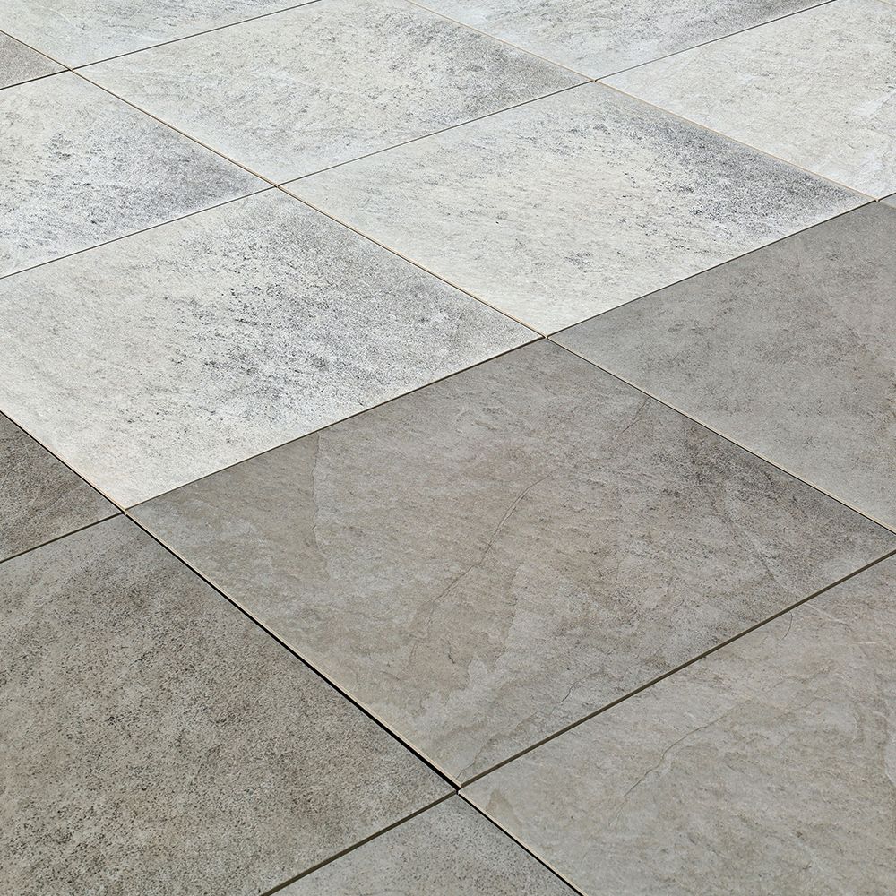 A close-up of a gray and white porcelain pavers