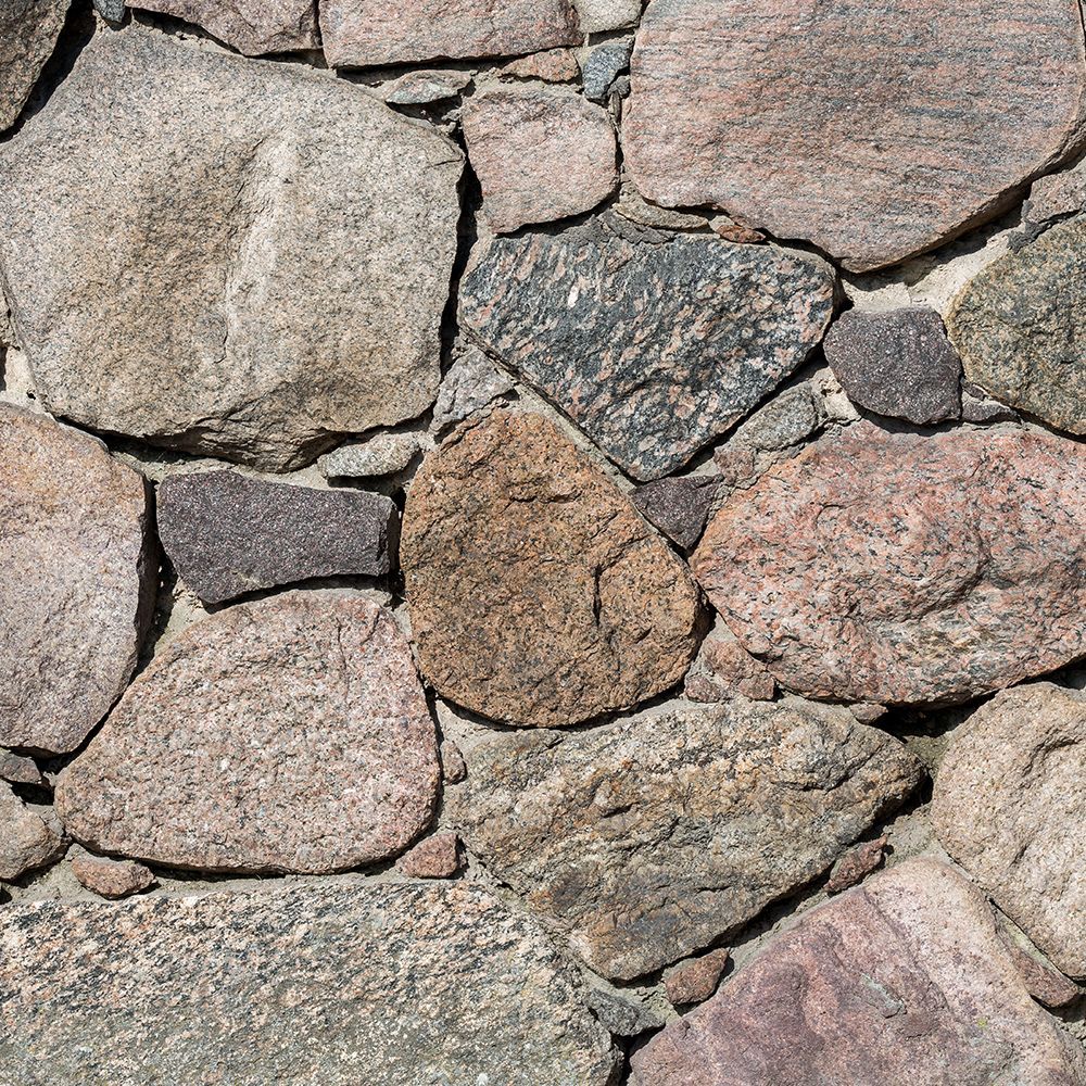 A close-up of a pile of rocks on a wall.