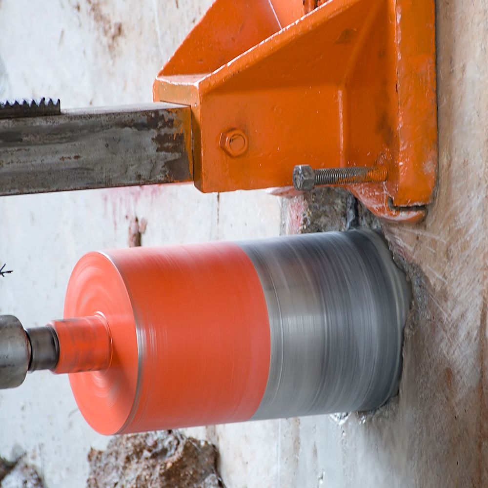 A machine is cutting a hole in a wall