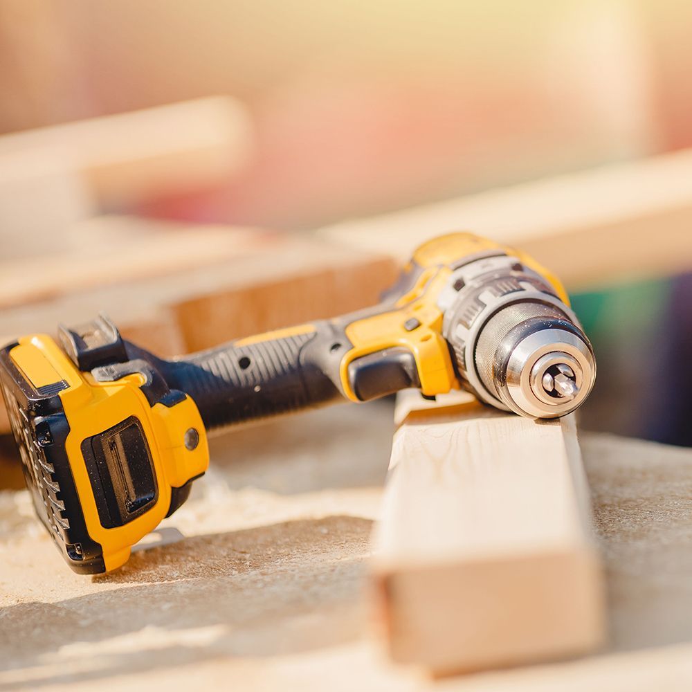 A yellow and black impact drill