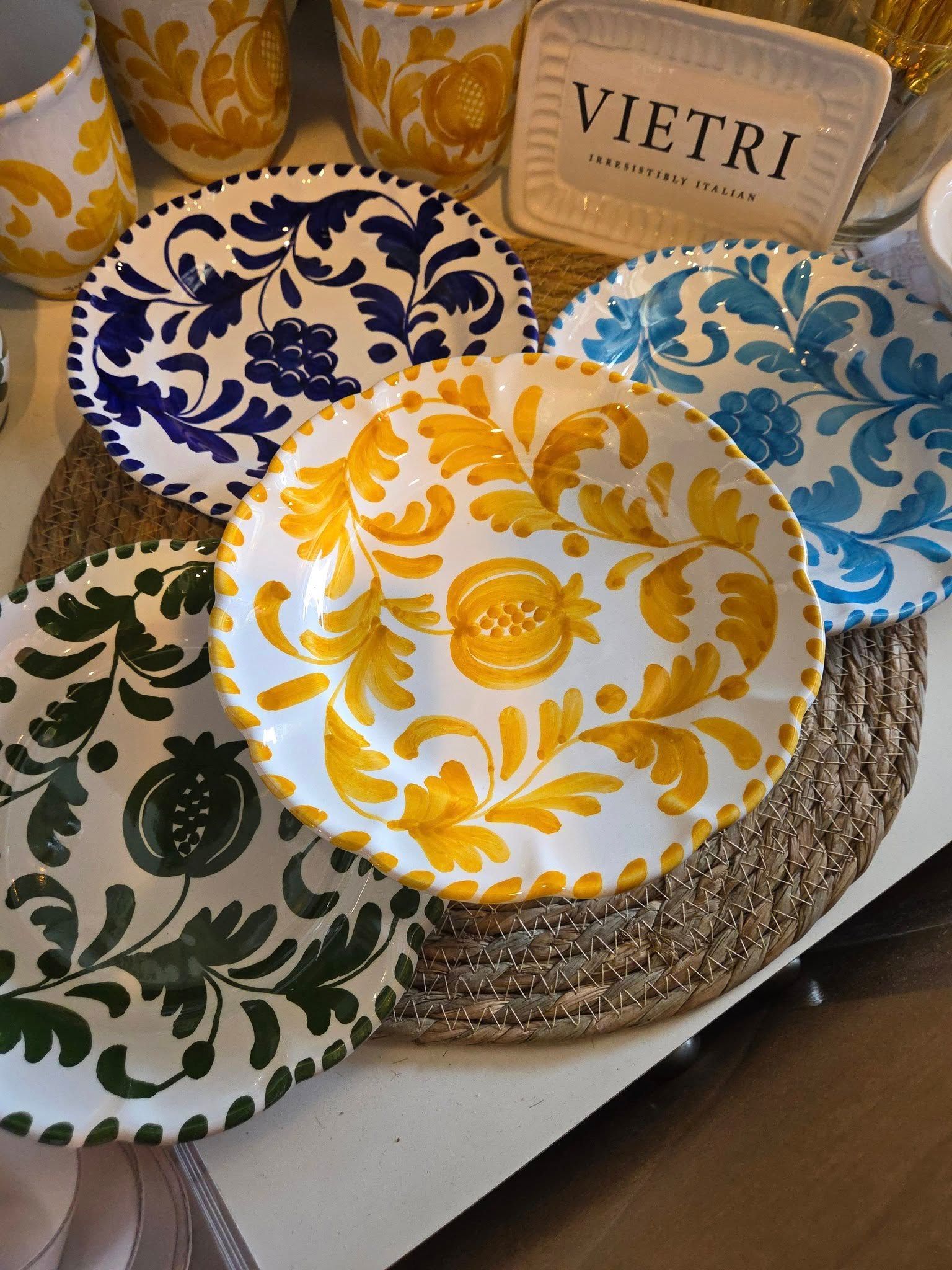 A table with plates and a sign that says vietri