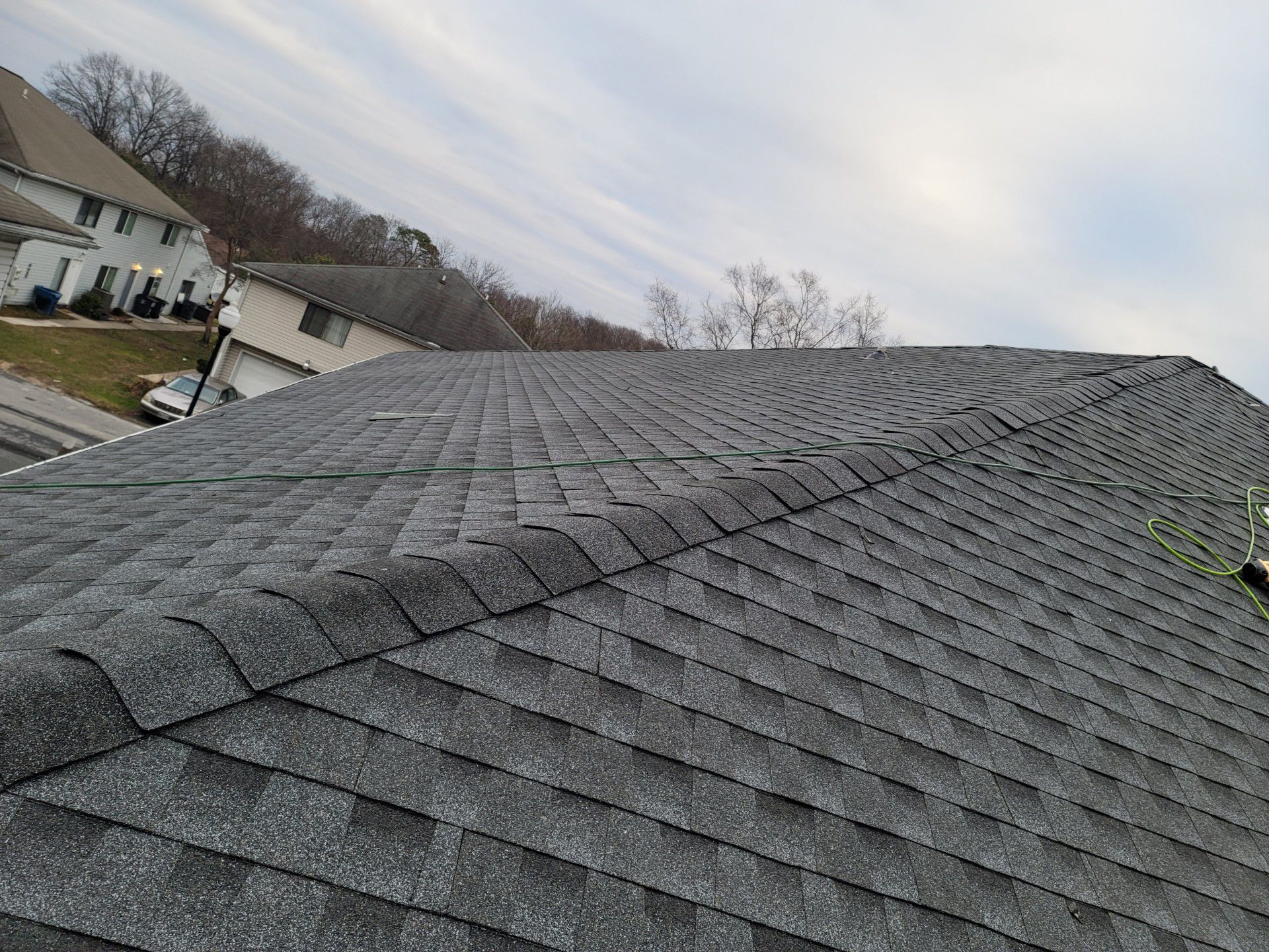 A close up of a roof with a lot of shingles on it.