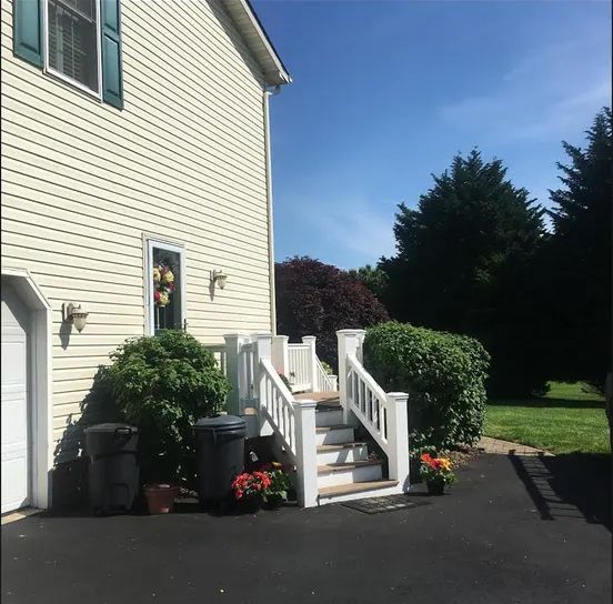 A house with stairs leading up to the front door
